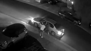 Surveillance footage outside Colorado apartment building shows armed gang members pointing weapons - Fox News